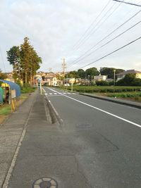 Road in city against sky