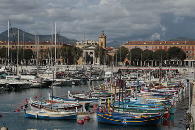 Boats moored at harbor