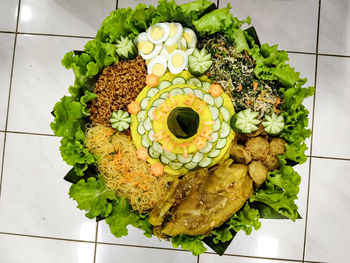 High angle view of fresh vegetables in plate on table