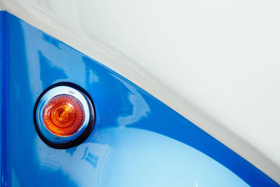 Close-up of light on blue car