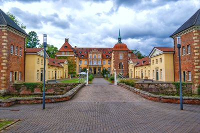 Buildings in city against sky