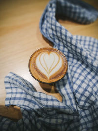 Close-up of piccolo latte on table. 