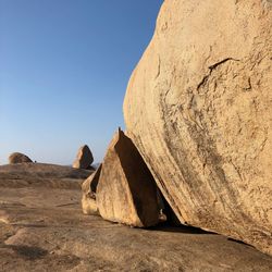 Rock formations in desert against clear sky