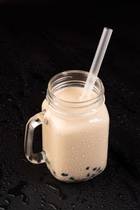 Close-up of drink in glass jar on table