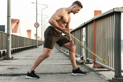 Full length of man exercising outdoors