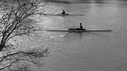 High angle view of people on river against trees