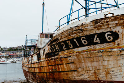 Old abandoned shipwrecks in the old boat cemetery, cimetiere de bateaux, at le sillon a cloudy day 