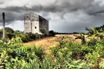 View of buildings against cloudy sky