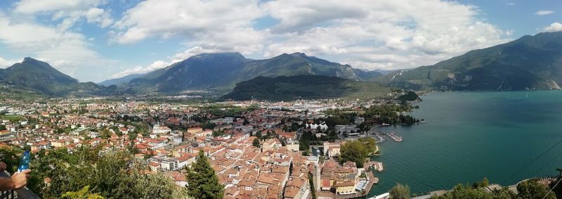 High angle view of townscape by mountains against sky