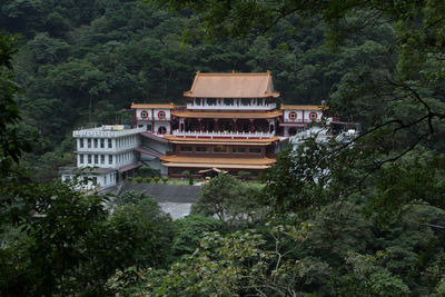 Built structure by trees in forest