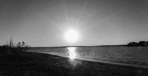 Scenic view of sea against clear sky during sunset