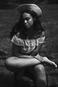 Young woman wearing hat on field