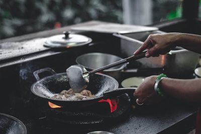 Cropped hands making food