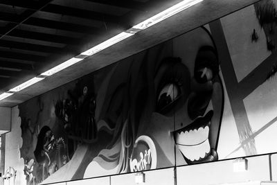 Low angle view of people on illuminated building