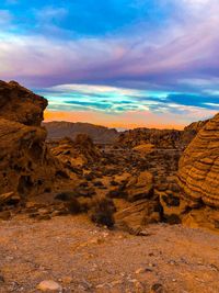 Rock formations on landscape against sky