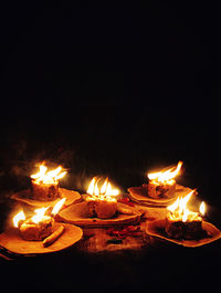 Close-up of fire burning in the dark