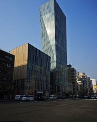 Modern buildings against clear blue sky