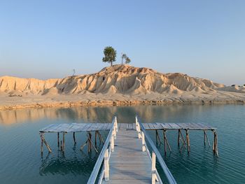 Scenic view of pier against clear blue sky