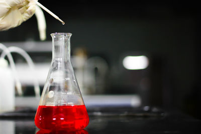 Close-up of red liquid on table