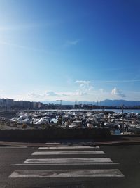 View of cityscape against blue sky