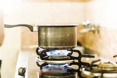 Tea container on stove in kitchen at home