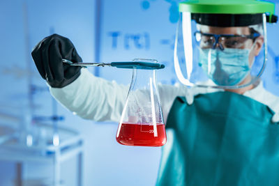 Female scientist experimenting in laboratory