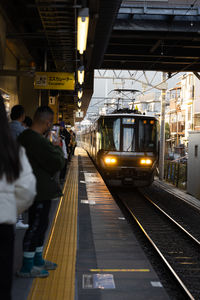 People walking on railroad station