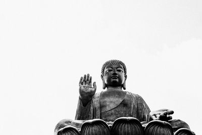 Low angle view of statue against sky