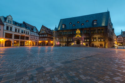 Illuminated buildings in city at night