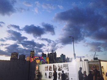 Buildings against cloudy sky