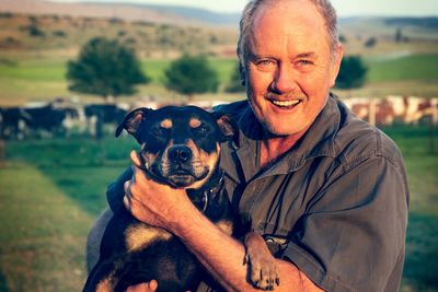 Portrait of farmer with staffie