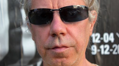 Close-up portrait of man wearing sunglasses