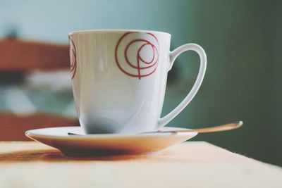 Close-up of coffee cup on table