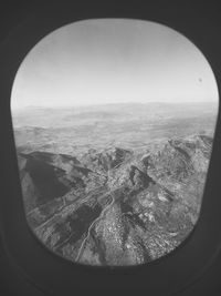 Scenic view of landscape seen through airplane window