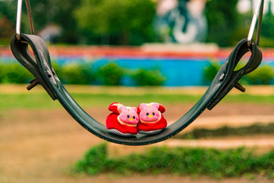 Close-up of animal representation on grass in playground