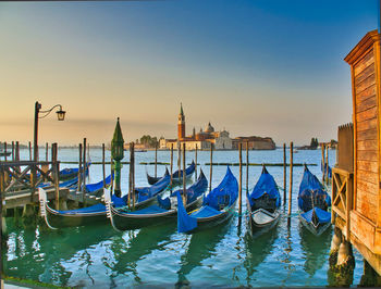 Boats moored in canal