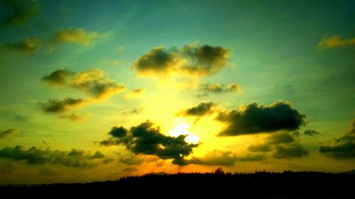 Low angle view of dramatic sky during sunset