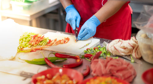 Midsection of woman preparing food