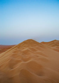 Scenic view of desert against clear sky