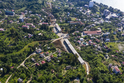 High angle view of street amidst trees and buildings