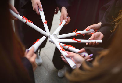 Close-up of hand holding cigarette