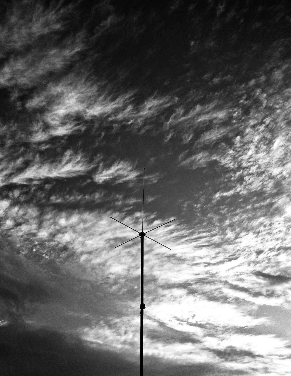 LOW ANGLE VIEW OF SILHOUETTE ELECTRICITY PYLON AGAINST SKY