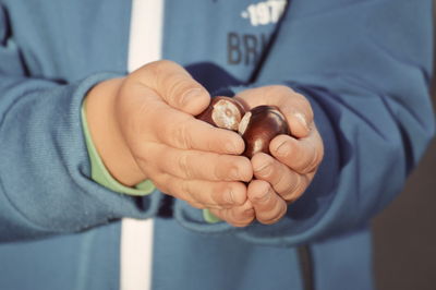 Close-up of hand holding hands