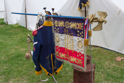 Clothes hanging on clothesline on field