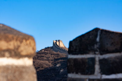 Low angle view of building against clear blue sky