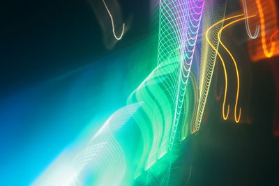 Low angle view of light trails at night