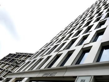 Low angle view of office building against sky