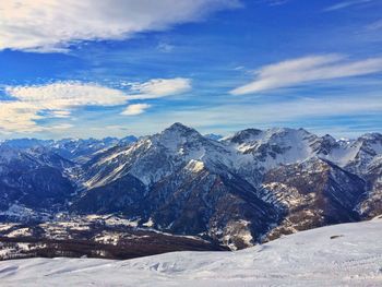 Scenic view of snowcapped mountains against sky