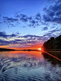 Scenic view of lake against romantic sky at sunset