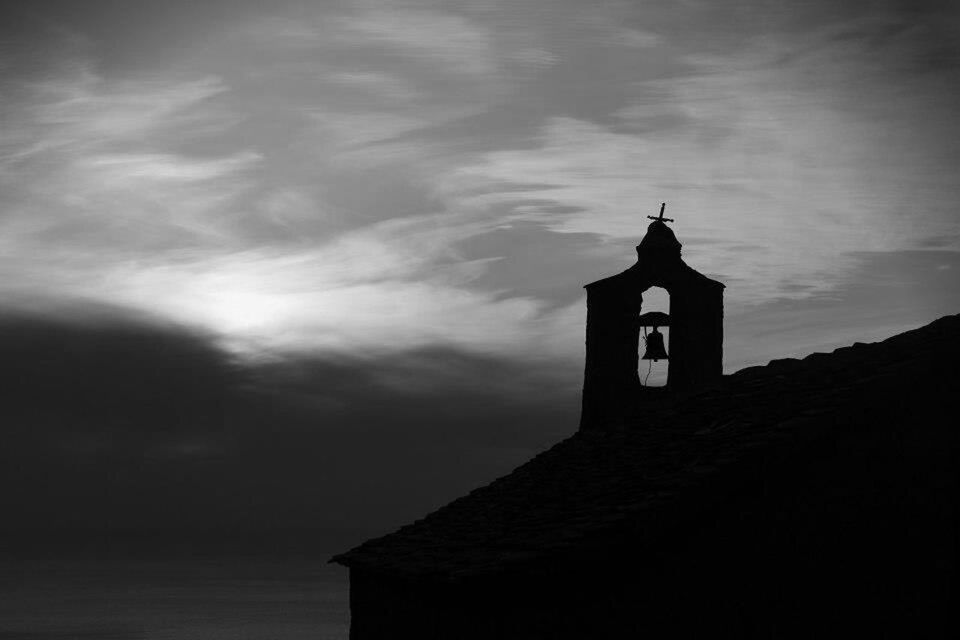 architecture, building exterior, built structure, low angle view, sky, religion, church, place of worship, spirituality, silhouette, cloud - sky, cross, cloudy, high section, cloud, tower, outdoors, no people